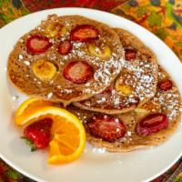 Strawberry Banana Pancakes · Served with real organic maple syrup and house-made butter.