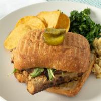 Marinated Tempeh Sandwich · Cashew cheese, caramelized onions, grilled tomato and arugula on a ciabatta roll.