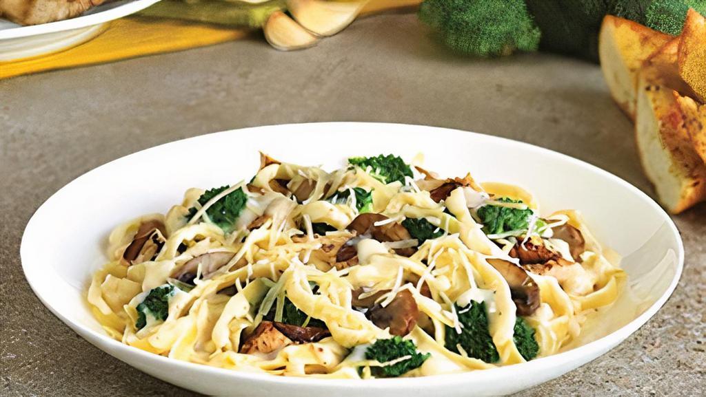 Chicken Fettuccine Alfredo · Grilled marinated chicken breast, sauteed broccoli and mushrooms in creamy Alfredo Sauce. Served over fettuccine, topped with shredded Parmesan cheese.