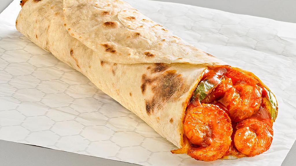 Shrimp Diablo Taco · Freshly grilled shrimp with onions, peppers, & tomatoes and marinated with spicy signature diablo sauce & served on a fresh flour tortilla.
