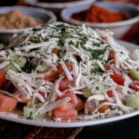 Shepherd Salad (Large) · A mosaic of freshly chopped tomatoes, onions, green peppers and cucumbers with red wine vine...