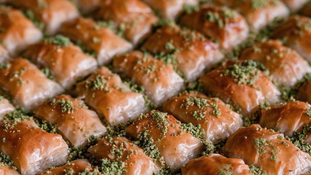 Baklava · Turkish pastry which is made of filo dough filled with crushed pistachios and homemade syrup.