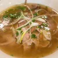 Old Saigon Pho / Phở Old Saigon · Thin sliced rare steak and well done brisket with rice noodles and fresh herbs in homemade b...