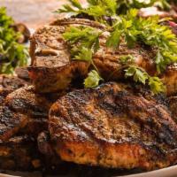 Lamb Chops · Marinated grilled lamb chops served with our spicy green Dakar sauce and a side of your choi...