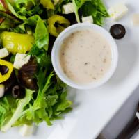 Greek Salad · Romaine hearts, tomatoes, cucumbers, feta cheese, kalamata olives, pepperoncini peppers, and...