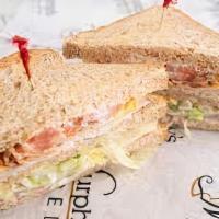 Turkey Supreme · Smoked turkey layered on toasted
wheat berry bread with swiss cheese,
lettuce, tomatoes, and...