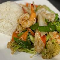 Cơm Do Biển Xào Rau Cải · Seafood stir fried with vegetable on rice.