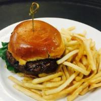 The Burger · Eight ounce certified Angus Beef burger with choice of cheese, on a brioche bun.