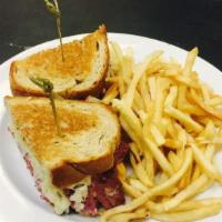 King Reuben · Shaved first cut corned beef, sauerkraut, swiss cheese, 1000 Island dressing, on toasted rye.