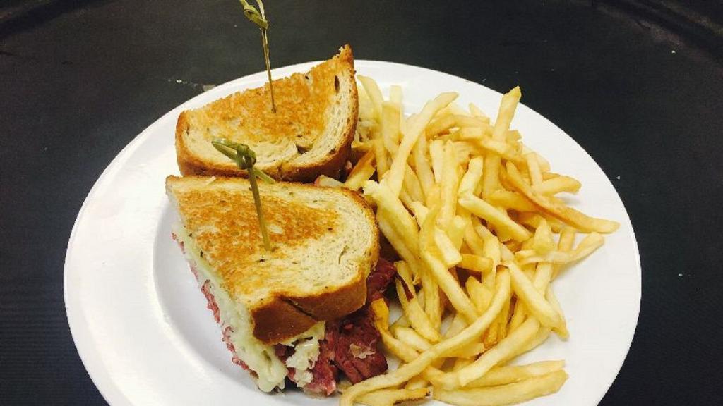 King Reuben · Shaved first cut corned beef, sauerkraut, swiss cheese, 1000 Island dressing, on toasted rye.