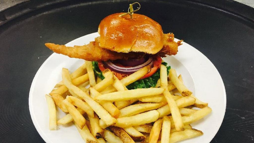 Jack'S Fish Sandwich · Traditional ale-battered Haddock, lettuce, tomato, red onion and remoulade on a brioche bun, served with thick cut English-style chips