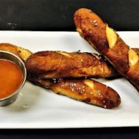House Pretzels · Warm Bavarian style pretzel sticks brushed with garlic butter, served with a spicy mustard s...