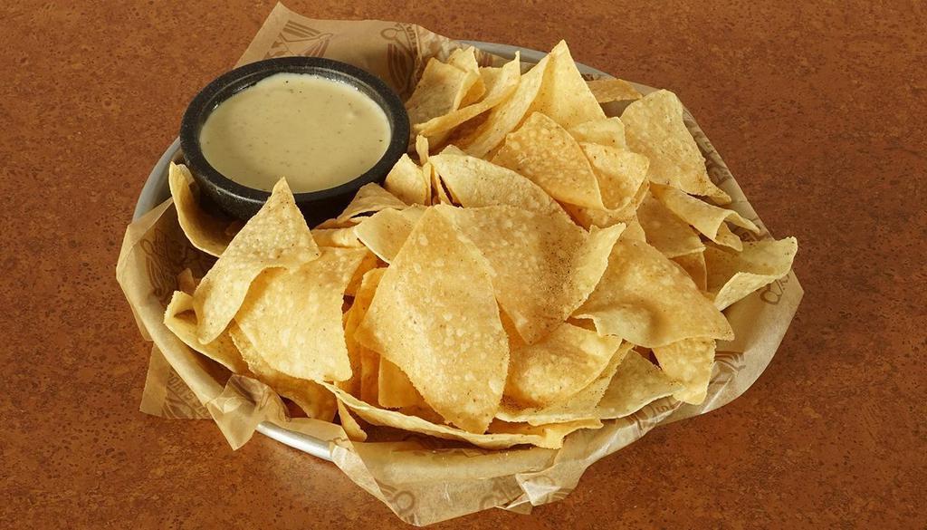 Chips & Queso · Fresh, Warm Tortilla Chips Seasoned With Our Southwest Seasoning And Served With Warm Queso Cheese.