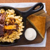 Boneyard Bbq Mac-N-Cheese · A Stack Of Our Always Tender Fall-Of The Bone Saucy Ribs Presented In A Bubbling Skillet Of ...