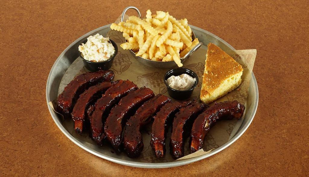 Full Order Ribs · Rubbed With Select Spices And Slow-Roasted To Fall-Off-The-Bone Perfection! Basted With Your Choice Of One Of Our Homemade BBQ Sauces. Served With Cheddar And Jalapeno Cornbread With Vanilla Honey Butter, Coleslaw and Your Choice Of Seasoned Crinkle Cut Fries, Cajun Ranch Waffle Fries With Seasoned Sour Cream, Beer Battered Onion Rings, Bent Arm Ale Sidewinder Fries Or Sweet Potato Fries.