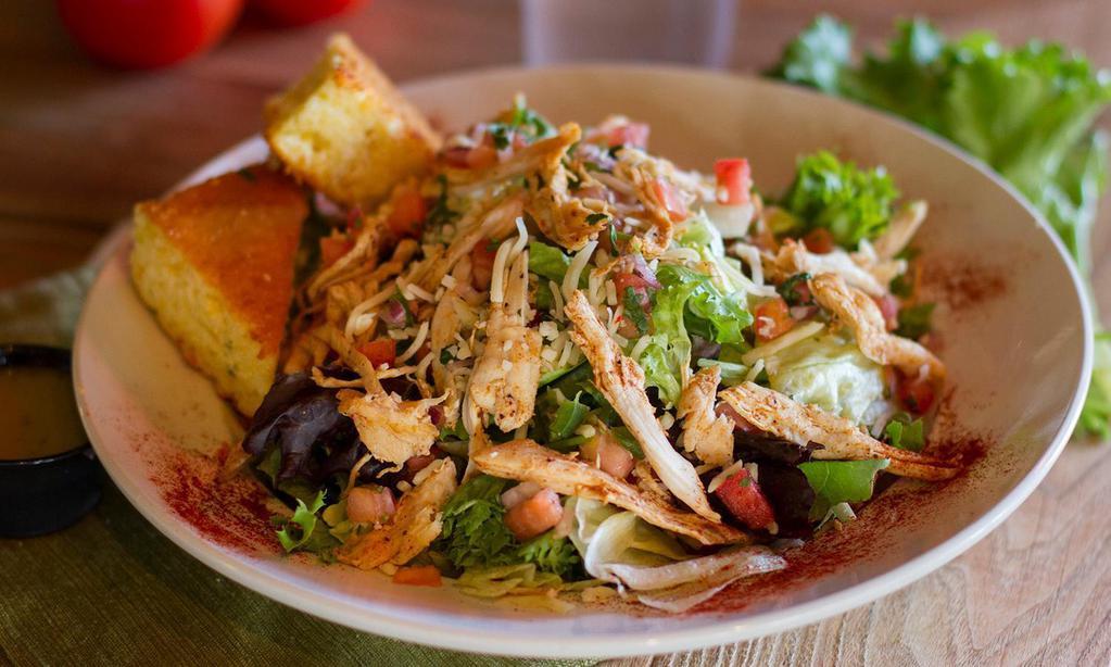 Cowboy Salad · A Bed Of Fresh Summer Greens Piled High, Pico De Gallo, Shredded Pepper Jack Cheese, Topped With Your Choice Of Seasoned Pulled Chicken Or Tender Steak Bites. Served With Zesty Lime Vinaigrette On The Side.