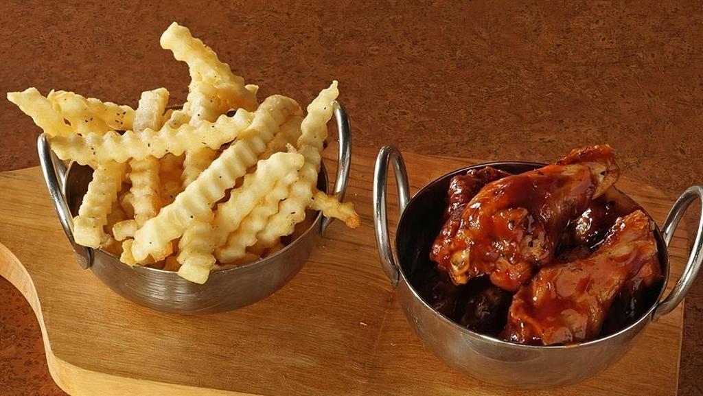 Kid Wings · 6 bone in traditional wings tossed in choice of sauce. Served with choice of ranch or bleu cheese. Ages 12 and under. Served with choice of strawberry apple sauce or french fries.