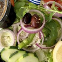 Large Greek Salad · A bed of romaine, onions, green peppers, cucumbers, shredded carrots, cabbage, tomatoes and ...