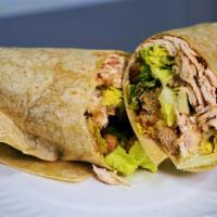 Grilled Chicken Caesar Wrap · Sliced grilled chicken breast served on a garlic herb wrap with romaine lettuce, creamy Caes...