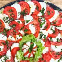 Caprese Salad · A salad with 
Lettuce 
Mozzarella Cheese 
Tomato 
Onion 
Oil and Vinegar 
Oregano