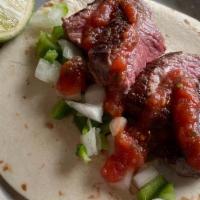 Carne Asada · Gluten free. Grilled mojo skirt steak, jalapenos & onions, salsa roja.