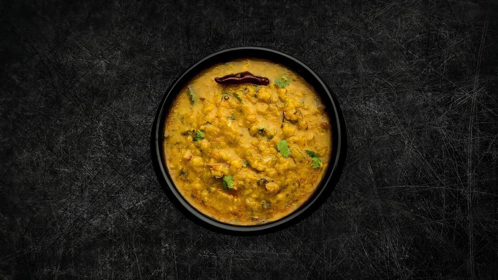Daal Bright Light(Vegan) · Mixed dark lentils, slow cooked overnight, tempered and served with a side of our aromatic basmati rice