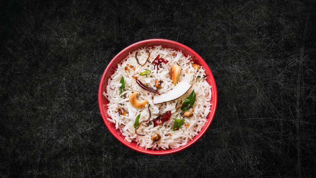 Exotic Coconut Rice (Vegan) · Special long grain imported rice, steamed to perfection and tempered with coconut, lentils and spices