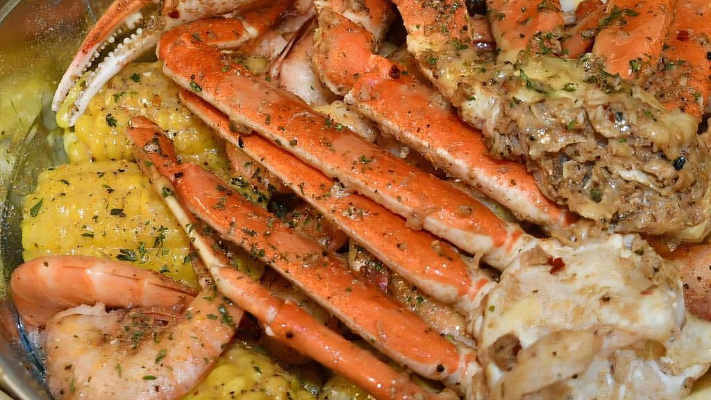Snow Crab And Headless Shrimp  1/2 Lbs · savory and salty flavors combine with your choice of spices will make your mouth water.