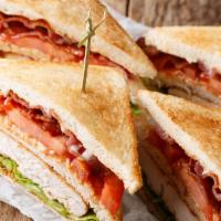 Turkey Club · Thick sliced turkey breast with lettuce, tomato, bacon, mayo, on toasted wheat bread, comes ...