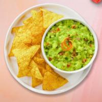 Classy Guacamole & Chips · A heaping scoop of fresh guacamole and warm tortilla chips.