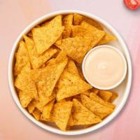 Queso Nova & Chips · Homemade melted cheese dip with warm tortilla chips.