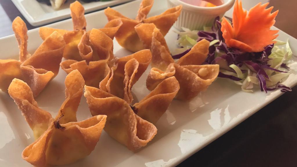 Crab Rangoon ( 8 Pcs.) · Crab meat with cream cheese. Served with a sweet and sour sauce.