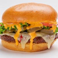 Dynamite Burger · A beef burger with pepperjack, dynamite hot sauce, lettuce, tomato, jalapeño and onion on a ...