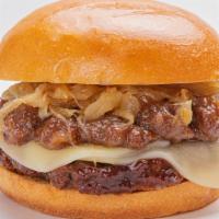 Bistro Burger · A beef burger with provolone, bacon jam and caramelized onions on a toasted bun.