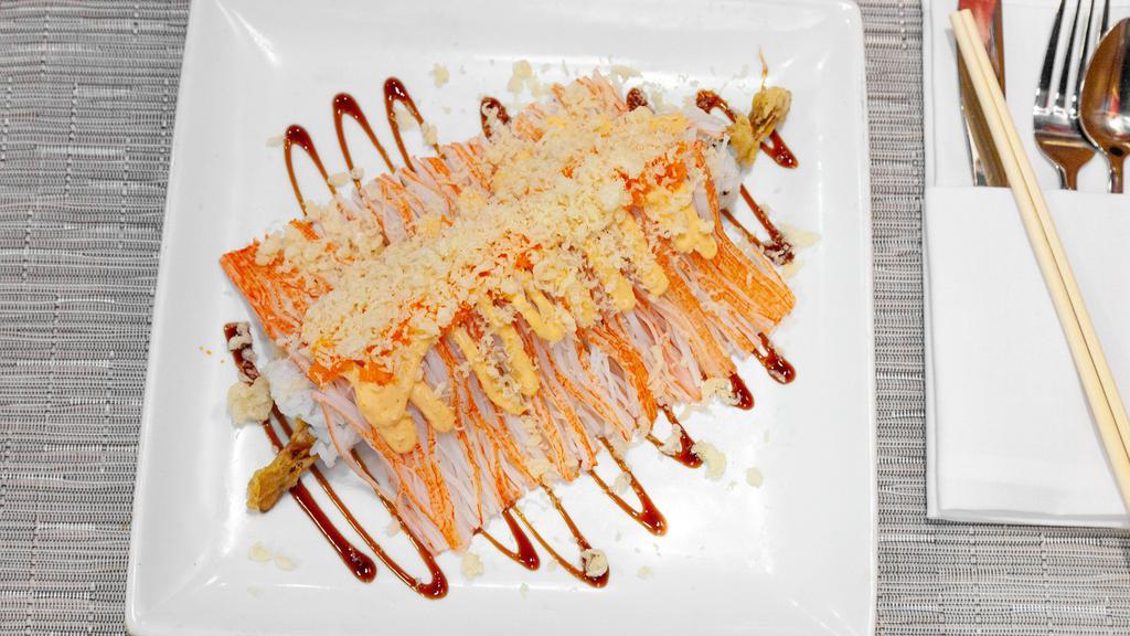 Monster Roll · Shrimp Tempura, Layered With Crab Stick Topped with Roe, Crunchy, Spicy Mayo & Eel Sauce