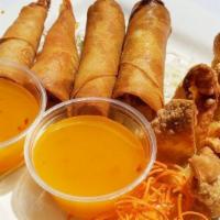 Sampler Platter · Sampler of two spring rolls, two crab cheeses, and two crispy shrimps served with plum sauce.