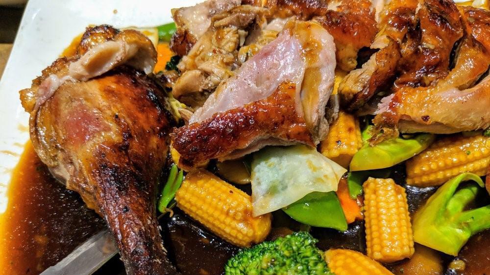 Sy Thai Duck · Roasted duck with broccoli, pea pods, baby corn, water chestnut, and carrots in a savory brown sauce.