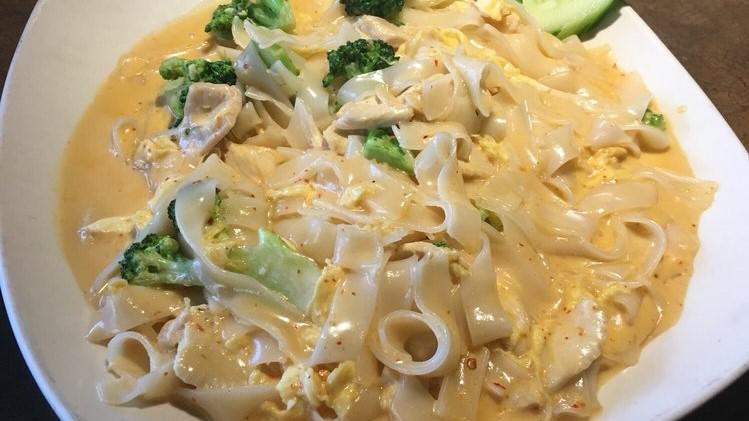 Noodle Roni · Gluten free.  Wok-tossed large noodles with broccoli and egg in a cheesy curry sauce. Spicy.