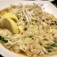 See Iew · Wok tossed large rice noodles with broccoli and egg in sweet soya sauce.