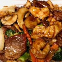 Four Seasons · Shrimp, beef, chicken, roast pork with mushrooms, broccoli, and mixed vegetables.