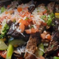 Steak Fajita · Steak cooked with onions, bell peppers and tomatoes.