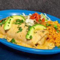 Los Compadres Burrito · Flour tortilla rolled with steak, chicken, shrimp and chorizo cooked with bell peppers and o...