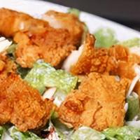 Crispy Chicken Caesar Salad · Crispy chicken on fresh garden salad.