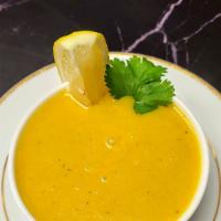 Mulligatawny Soup · The famous soup made from lentils, simmered with spices, and served with a wedge of lemon.