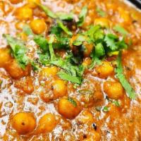 Channa Masala · Chickpeas onions & tomatoes cooked in tangy gravy. Served with rice.