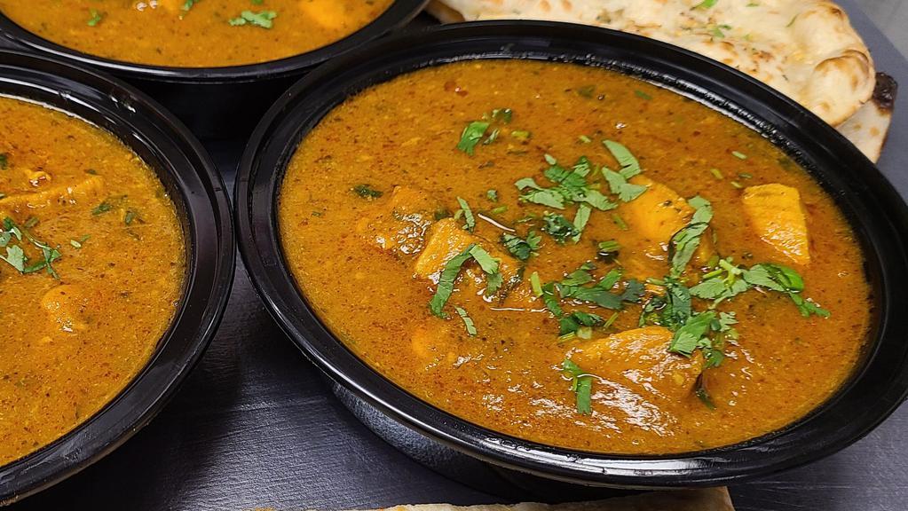 Chicken Curry · Chicken made with traditional Indian curry sauce. Served with rice.