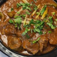 Lamb Karahi · Lamb in a curry with tomatoes, Ginger & Garlic. Served with rice.