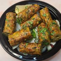 Chicken Seekh Kebab · Minced chicken blended with herbs and spices roasted on skewers. Served with rice.