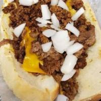 Chili Cheese Steak · topped with sautéed onions, American cheese, chili and raw onions on a hero roll