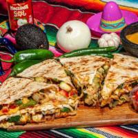 Veggie Quesadilla · Grilled bell peppers, onions, tomato and squash.